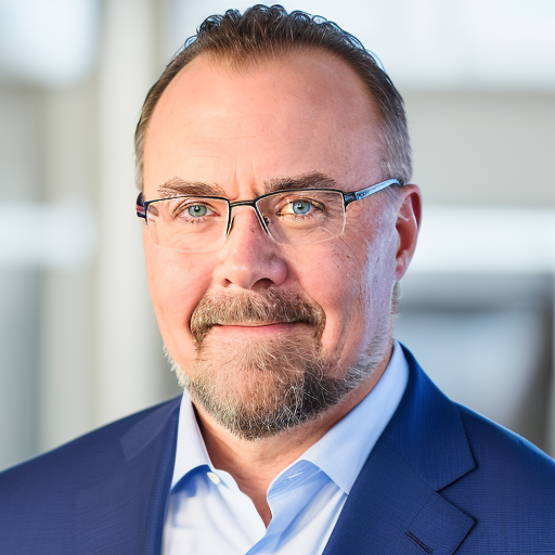 Professional portrait of Brian Lora in a blue suit